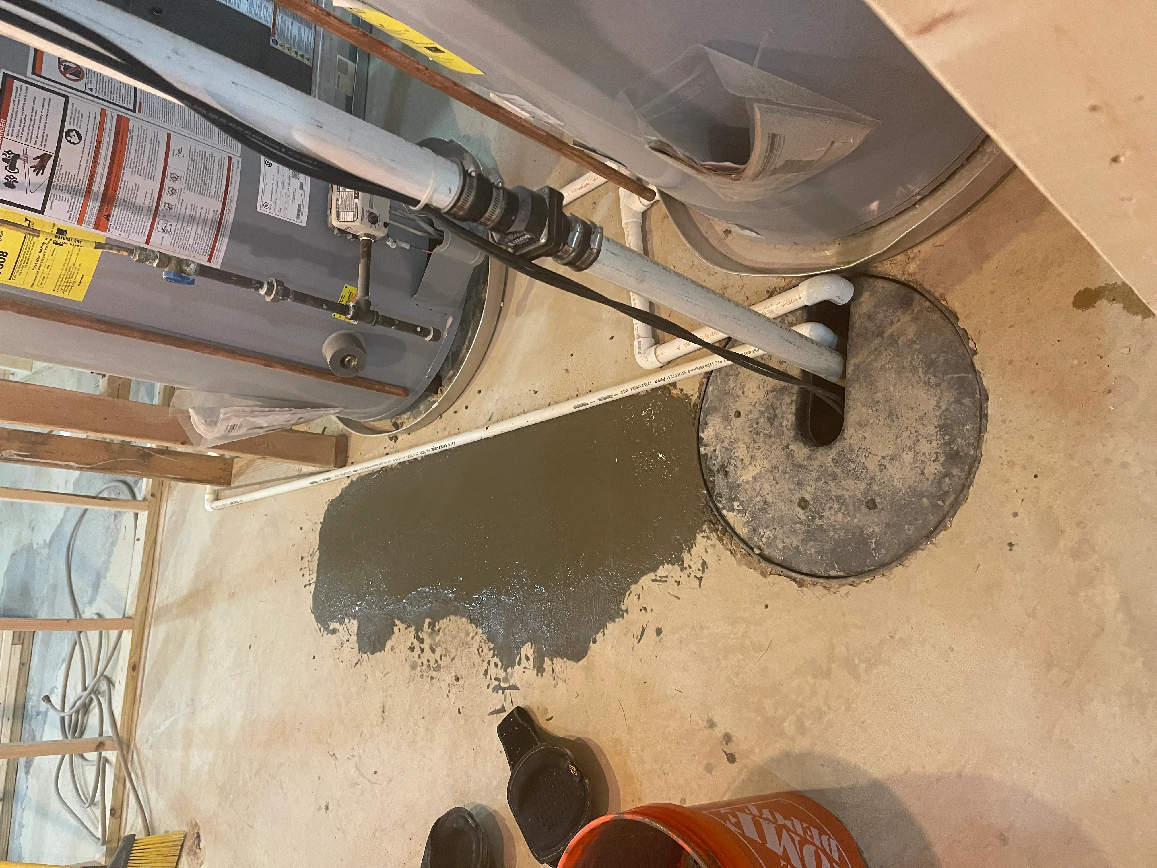 Installed water heater with copper piping connections and control panel in utility space