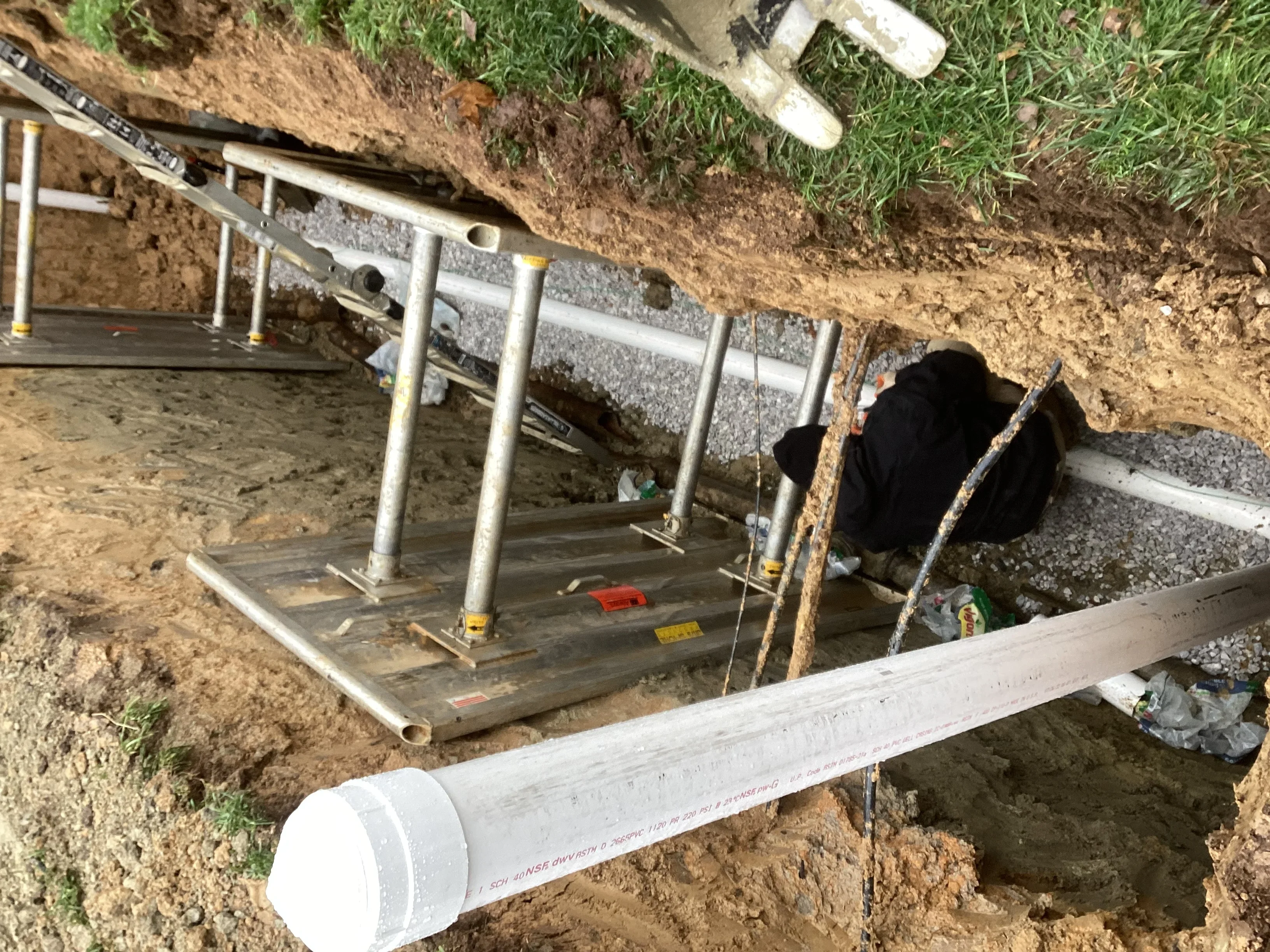 Underground drainage vault with PVC piping and metal support structure during installation