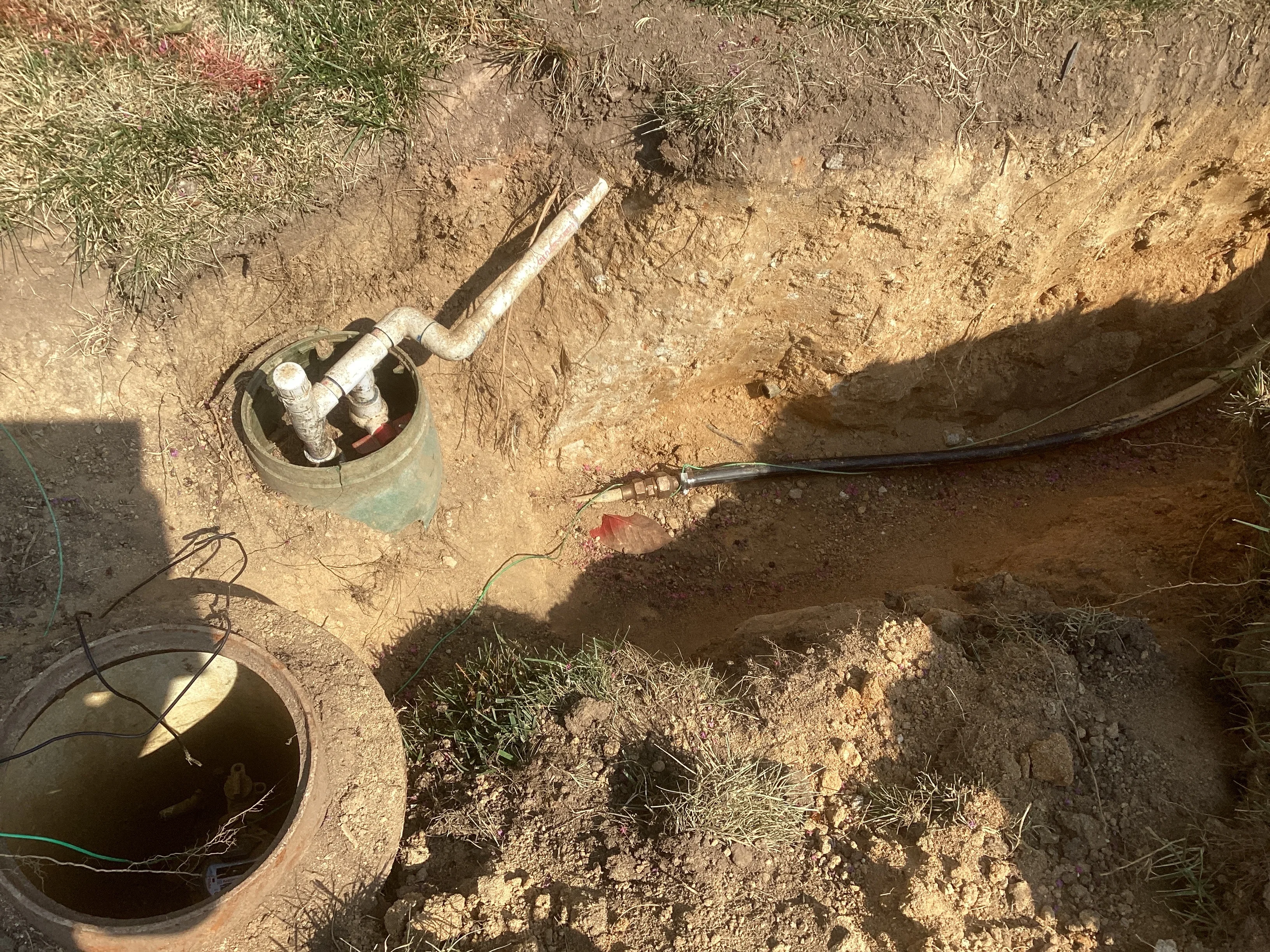 Septic system installation with concrete boxes and PVC piping in Manassas